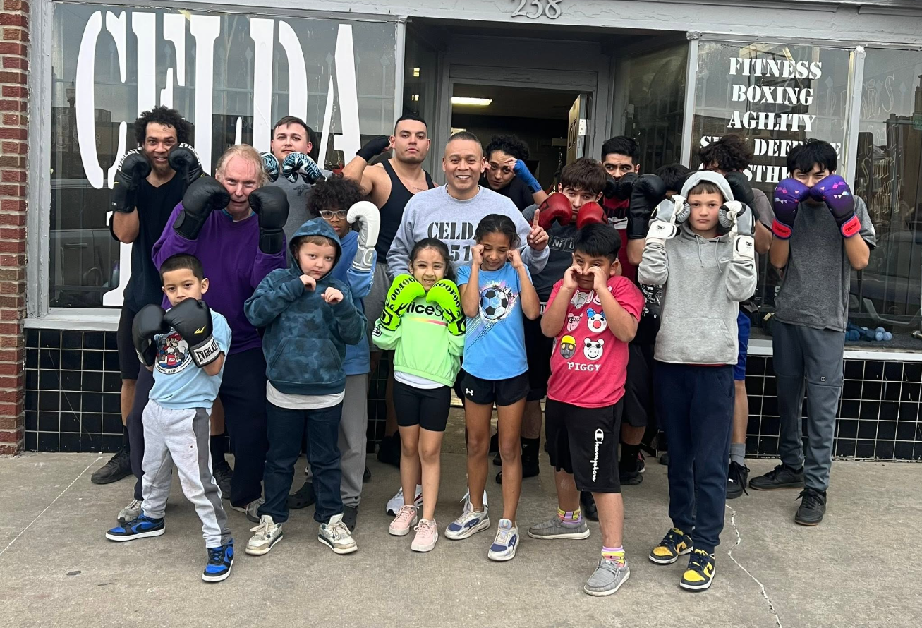 Celda 151 community gathered inside the gym