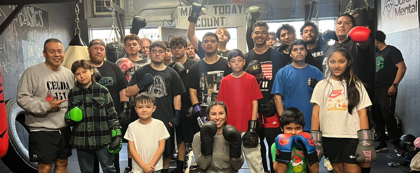 Celda 151 youth and coaches together in the boxing gym